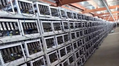 Crypto mining farm with rows of ASIC miners humming