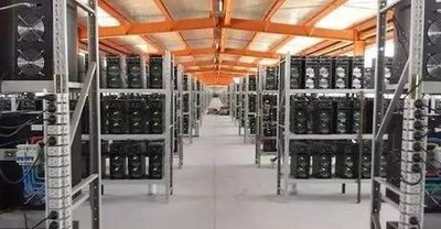 Inside a large-scale mining farm, highlighting the need for comprehensive warranty solutions.